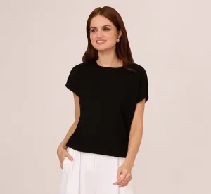 Short Sleeve Exposed Seam Pullover Sweater In Black